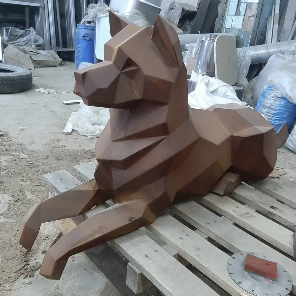 Corten steel low-poly dog sculpture with a natural rust finish