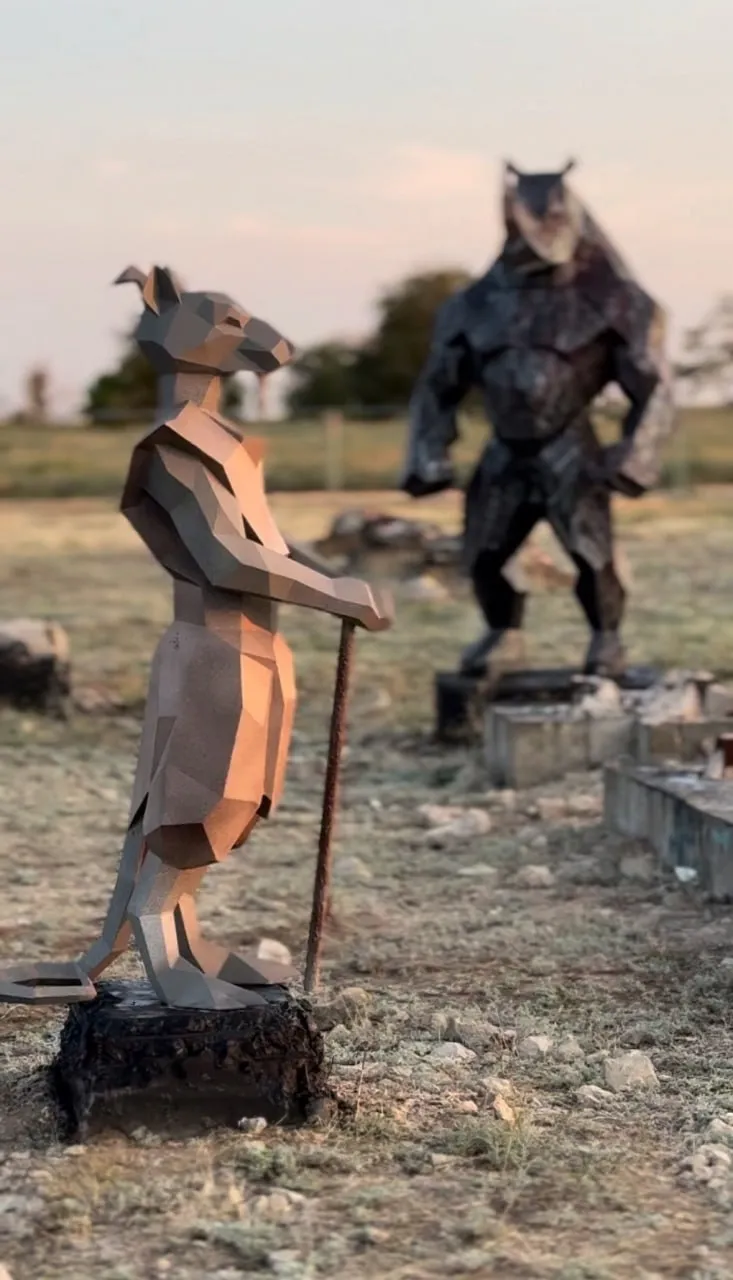 Kangaroo and owl steel sculptures at sunset